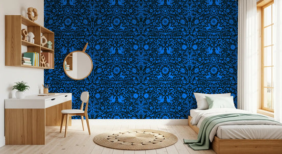 Blue Mexican folk wallpaper in a bedroom with a study desk GD11837