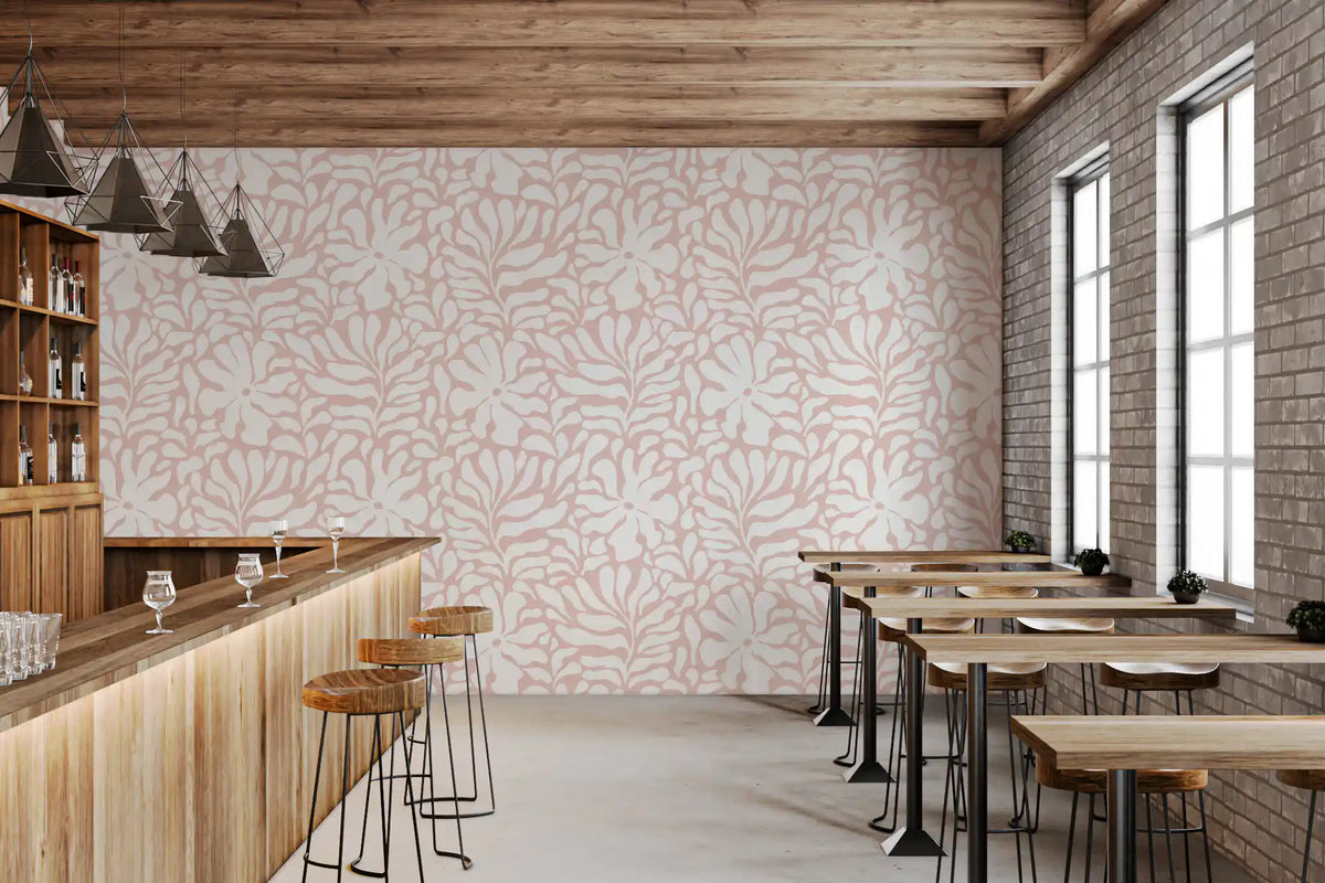 Blush pink foliage wallpaper in a warm cafe space GD11843