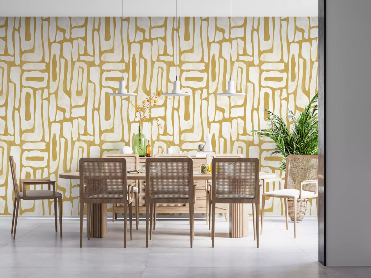 Gold interlocking forms wallpaper behind a dining table GD11868