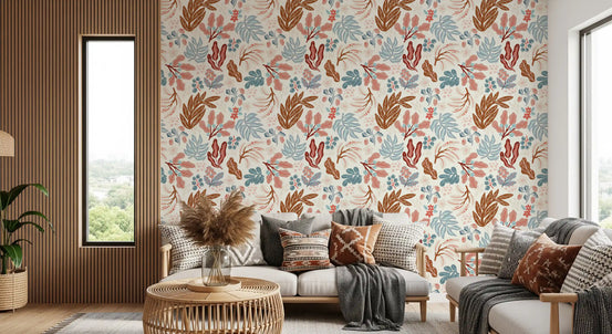 Muted autumn botanical folk art wallpaper in a cosy living room with rattan seating and warm wood GD11893