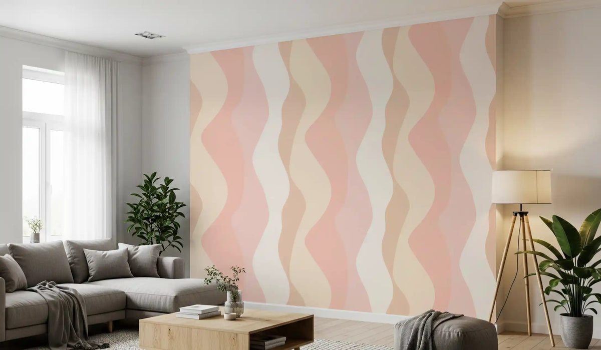 Blush wavy stripe wallpaper behind a grey sofa in a bright living room GD11902