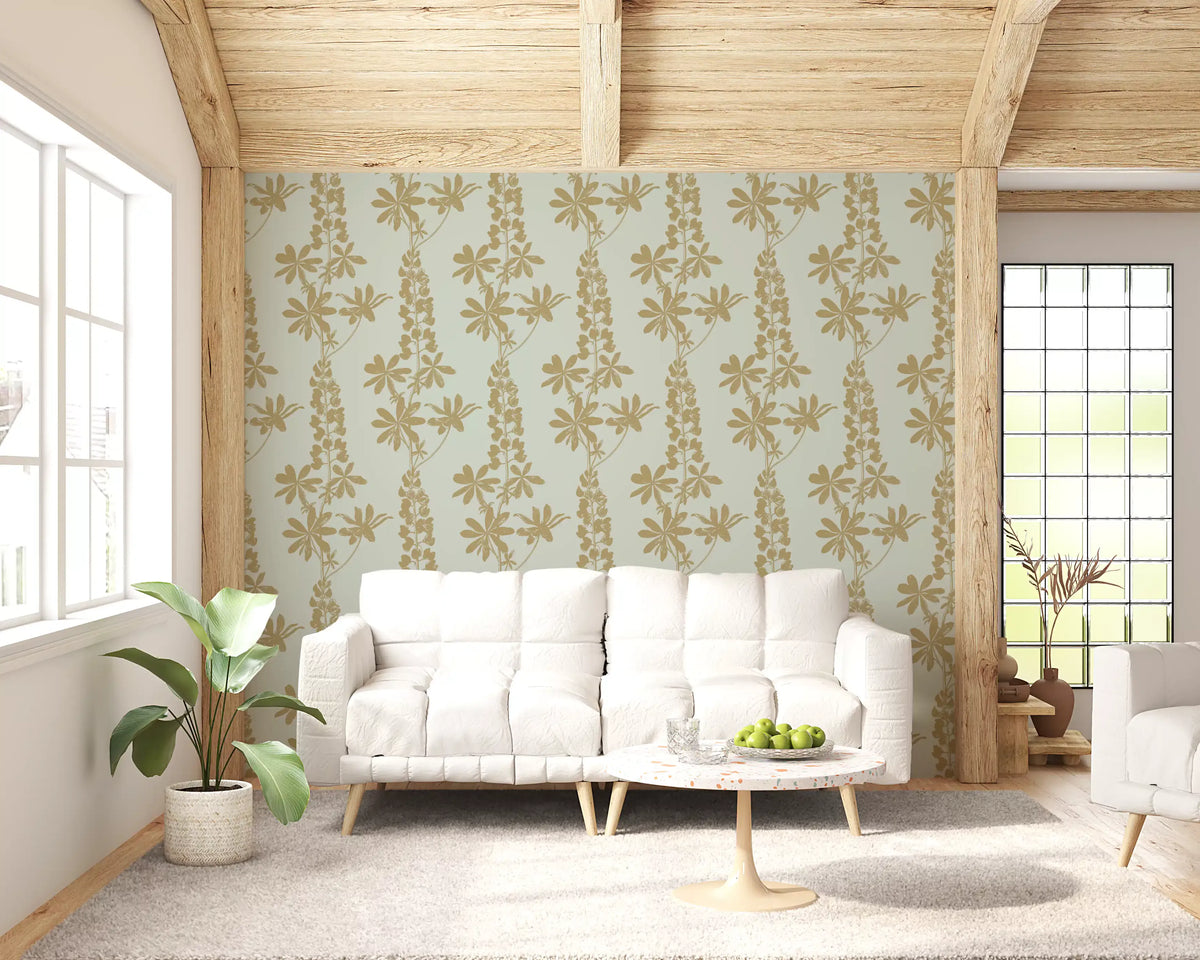 Gold lupine botanical wallpaper behind a white sofa in a bright living room GD11912