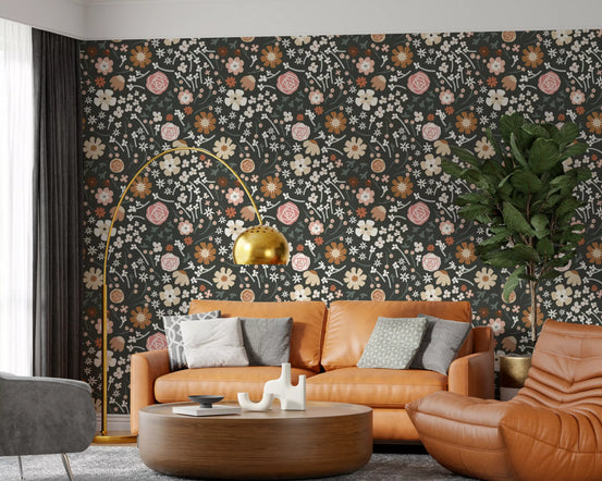 Dark floral meadow wallpaper in a living room with a tan leather sofa GD11920