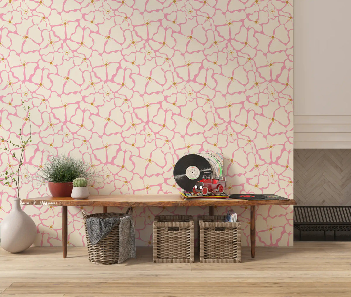 Blush floral wallpaper behind a console table with vinyl records and baskets GD11930