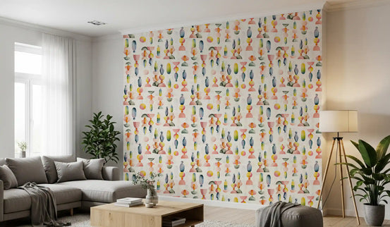 Multicolour abstract pebble wallpaper on a living room feature wall behind a grey sofa GD12122