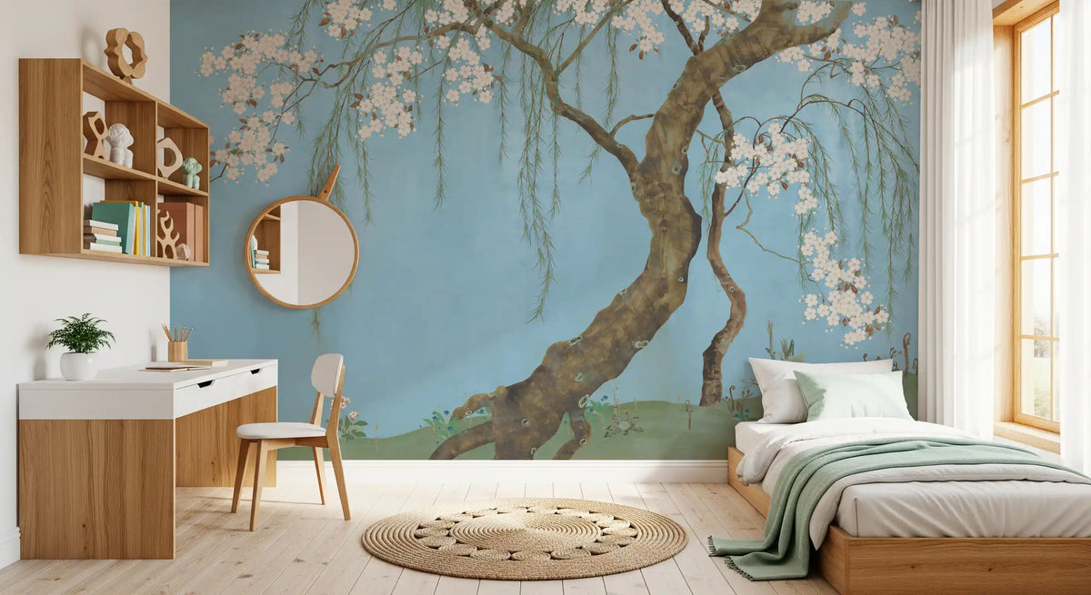 Serene cherry blossom willow tree mural on a soft blue sky shown in a bedroom GD12158