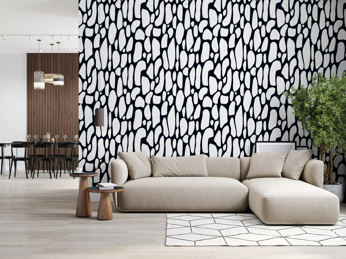 Black and white pebble wallpaper in a living room with a beige sectional sofa GD12223