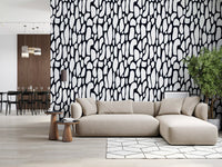 Black and white pebble wallpaper in a living room with a beige sectional sofa GD12223