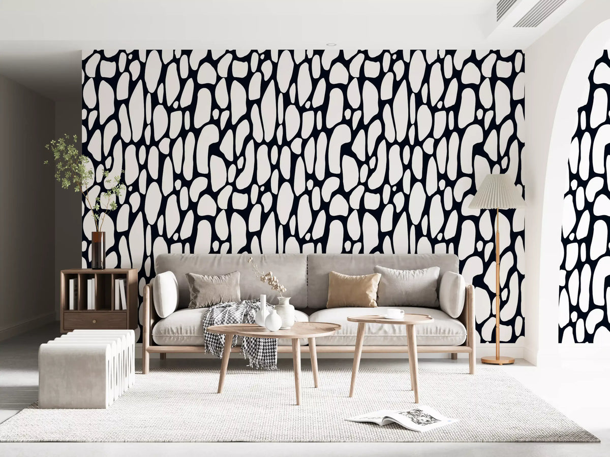 Monochrome pebble abstract wallpaper behind a sofa in a modern living room GD12223