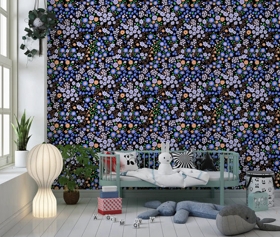 Boho garden floral wallpaper in a nursery with a mint cot and soft toys GD12227