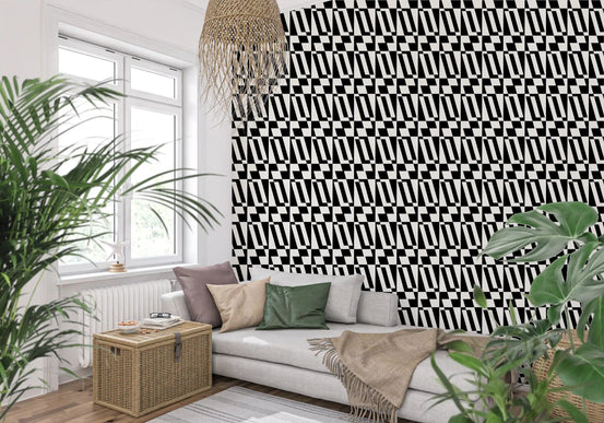 Geometric tiling wallpaper on a cosy living room feature wall with a beige sofa and plants GD12252