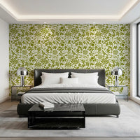 Green botanical silhouette wallpaper behind a bed in a modern bedroom GD12255