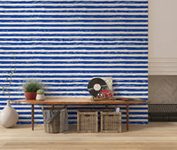 Navy striped wallpaper behind a wooden console in a living room GD12267