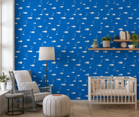 Blue aquatic fish wallpaper in a nursery with a crib GD12268