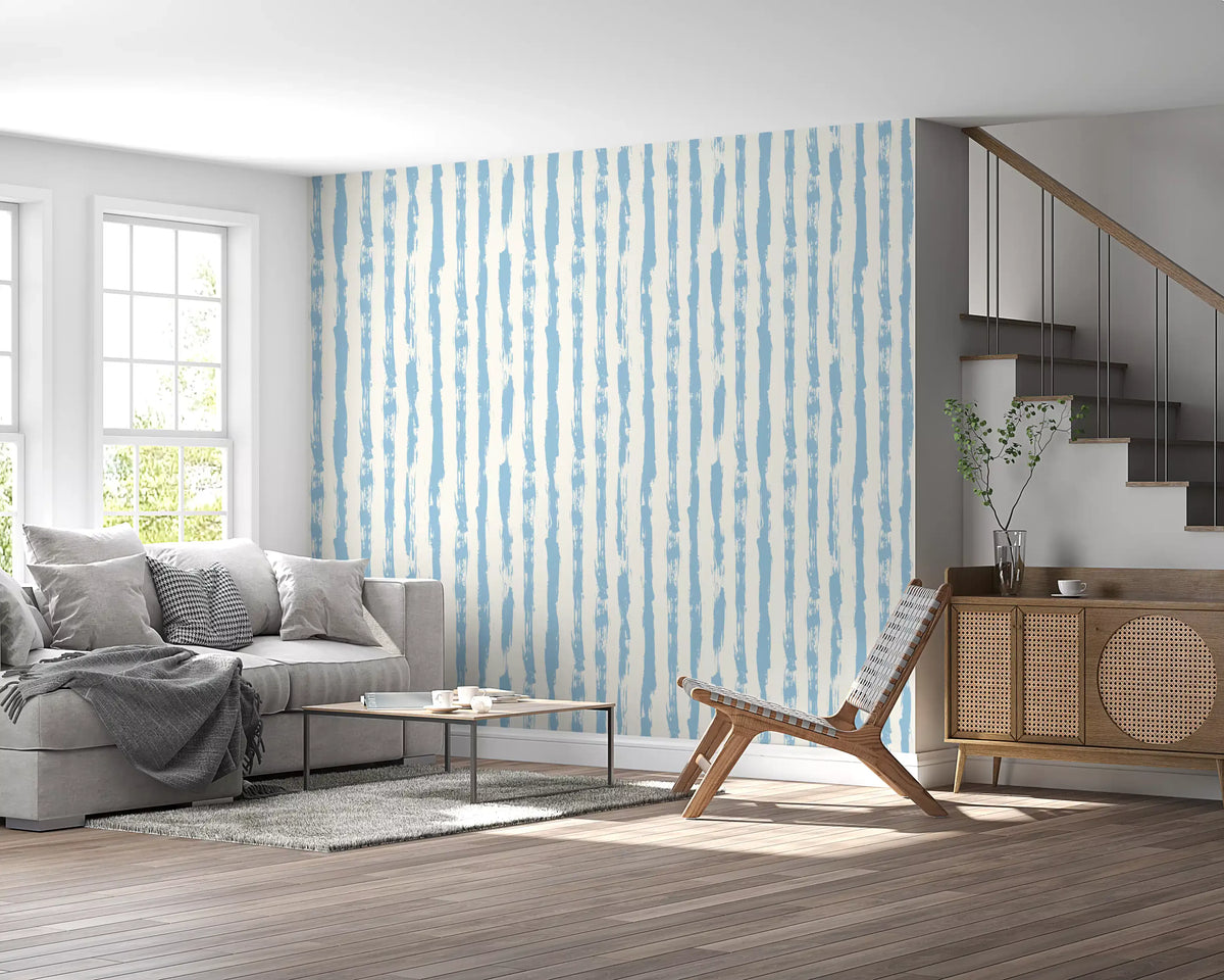 Blue striped wallpaper in a light living room with grey sofa GD12270