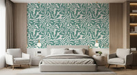 Sage green botanical leaf wallpaper in a styled interior GD12272