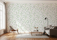 Soft leaf sprig wallpaper in a sunlit living room with a lounge chair and grey sofa GD12282