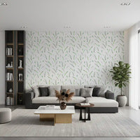 Green leaf sprig wallpaper in a modern living room with a grey sofa and dark bookshelves GD12282