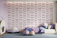 Pink butterfly wallpaper in a children's room with a bed and space toys GD12294