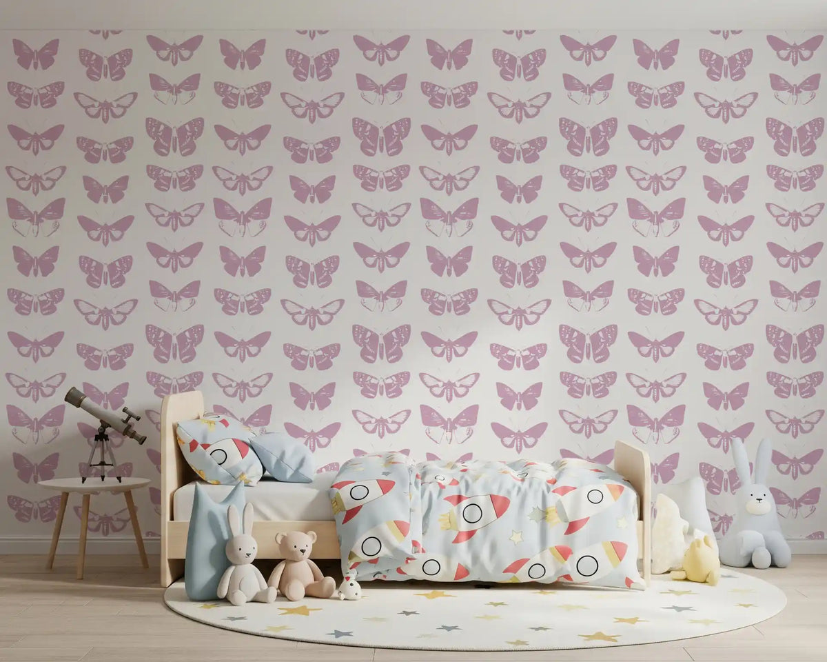 Pink butterfly wallpaper in a child's bedroom with a bed and telescope GD12294