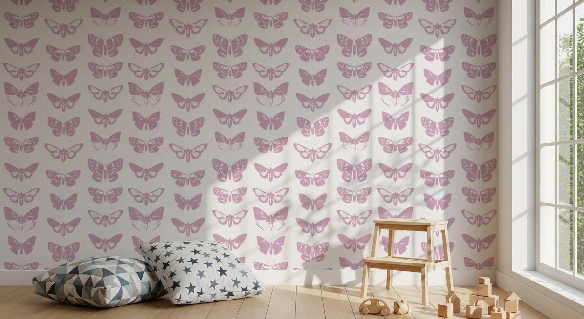 Pink butterfly wallpaper in a children's room with floor cushions and toys GD12294
