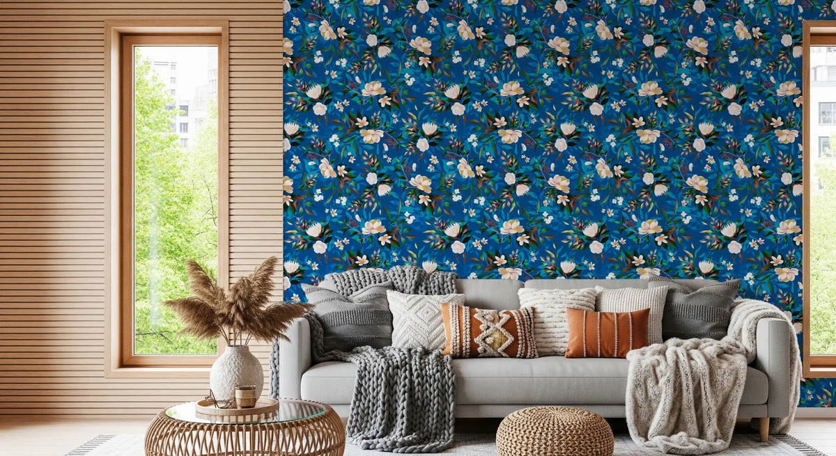 Indigo floral wallpaper in a living room with a grey sofa and window GD12295