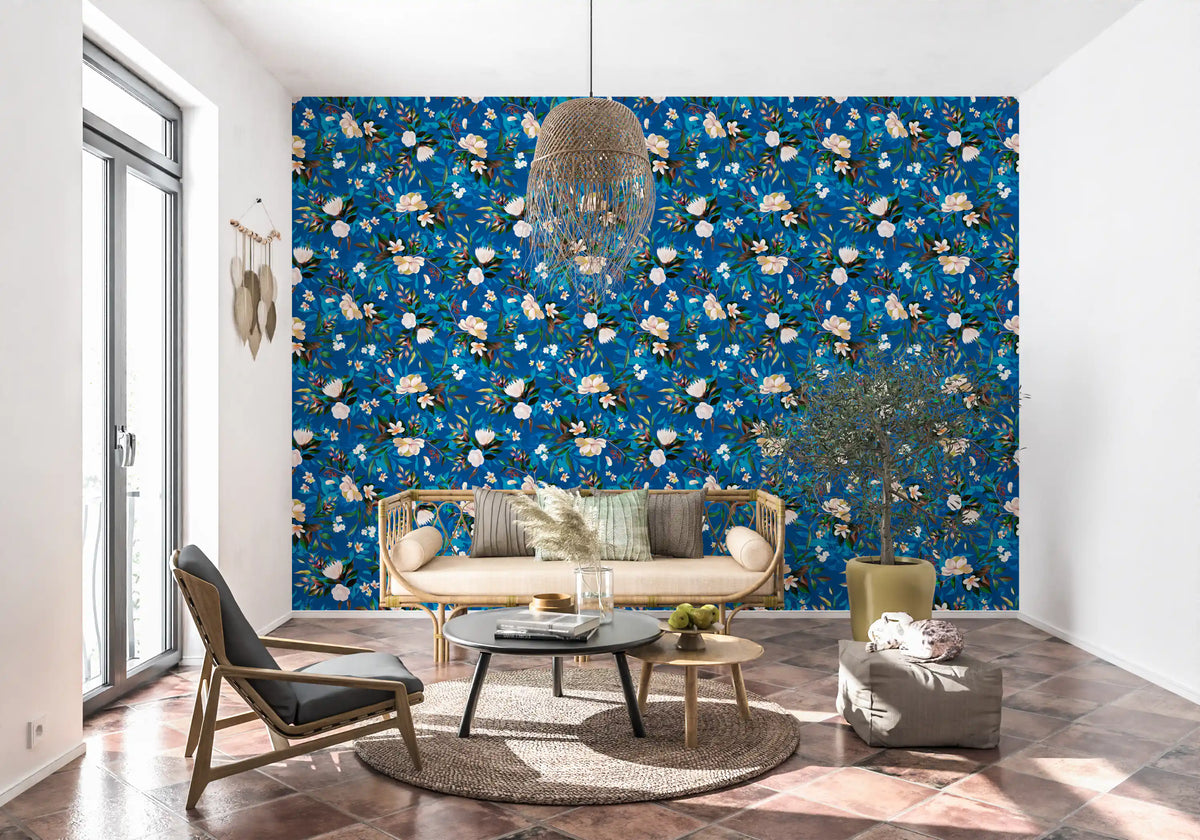 Indigo floral wallpaper in a living room with a cane sofa and round table GD12295