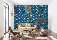 Indigo floral wallpaper in a living room with a cane sofa and round table GD12295