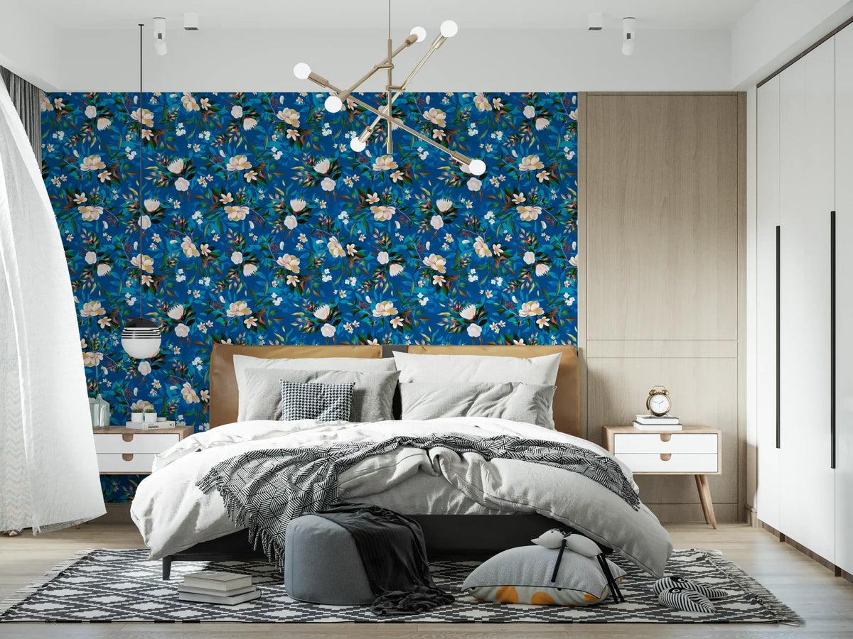 Indigo floral wallpaper behind a grey bed in a modern bedroom GD12295
