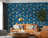 Indigo floral wallpaper in a living room with a tan leather sofa GD12295
