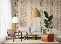 Abstract dot wallpaper in a living room with a rattan pendant and leather pouf GD12303