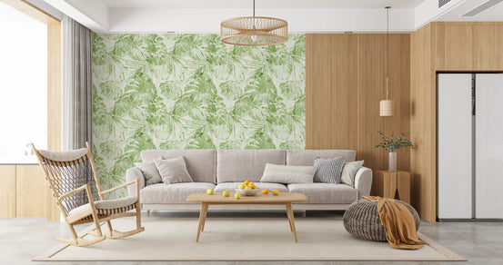 Green tropical leaf wallpaper in a bright living room with a grey sofa GD12314