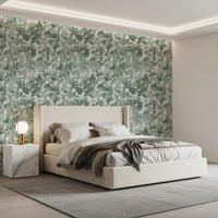 Green leaf canopy wallpaper in a bedroom with cream bedding GD12325