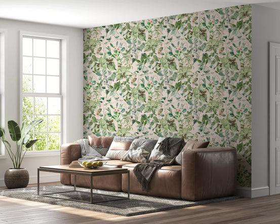 Sage floral wallpaper in a living room with a brown leather sofa and plant GD12339
