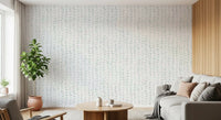 Pale green leaf wallpaper in a cosy living room with a cream sofa GD12359