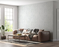 Soft leaf vine wallpaper in a living room with a brown leather sofa GD12359