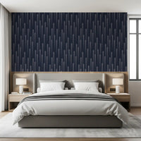 Ascending arrow wallpaper behind an upholstered bed in a bedroom GD12453