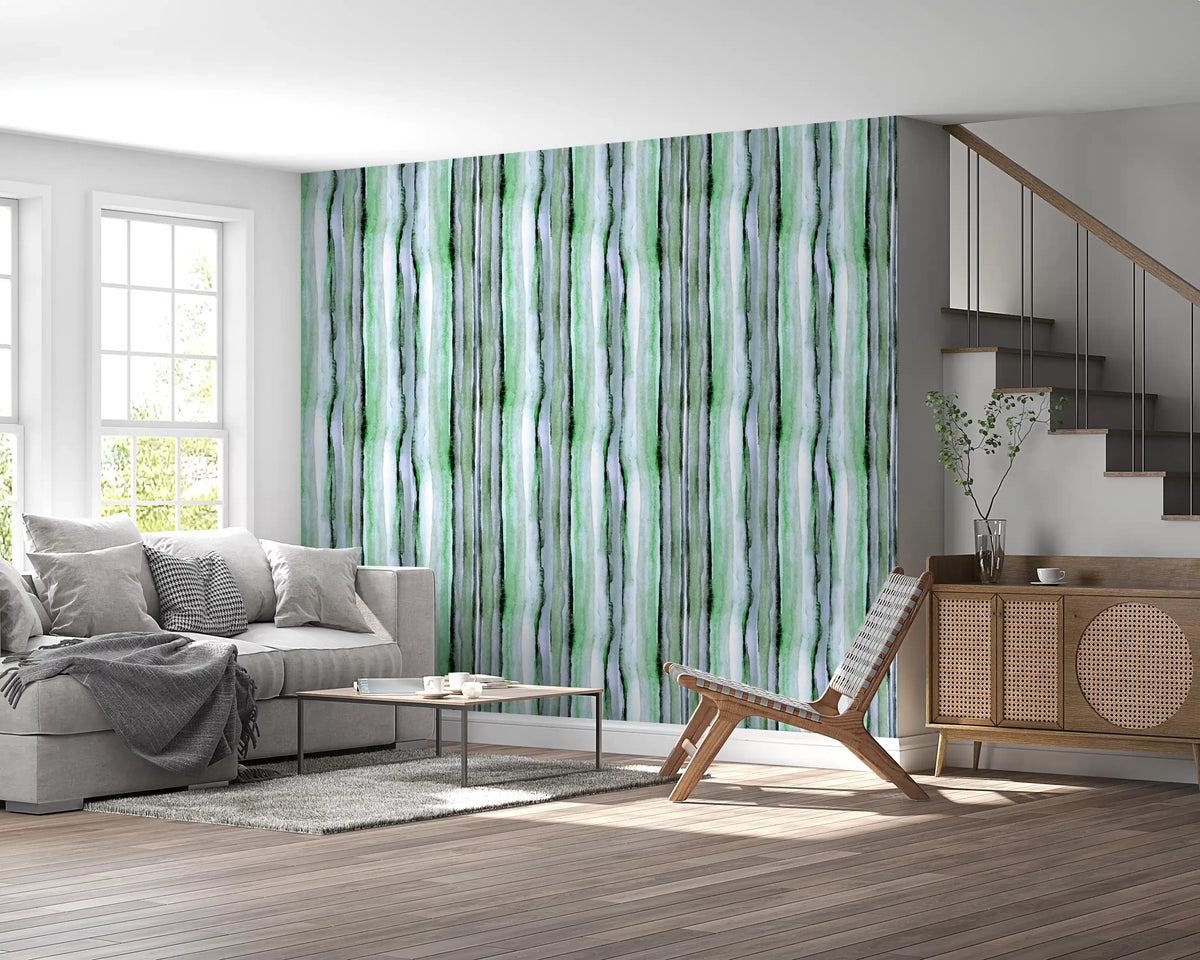 Green watercolour stripe wallpaper in a bright living room with grey sofa GD12468
