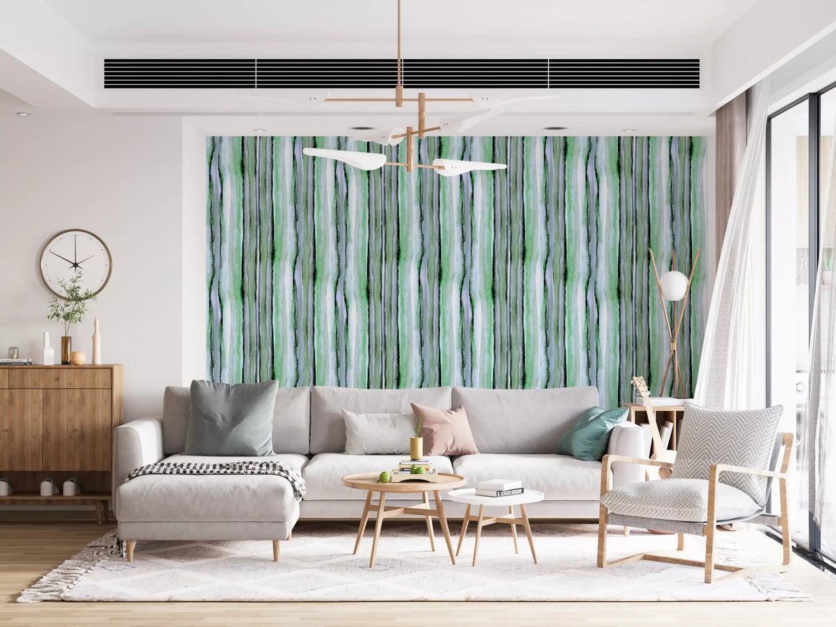 Green watercolour stripe wallpaper in a bright living room with grey sofa GD12468