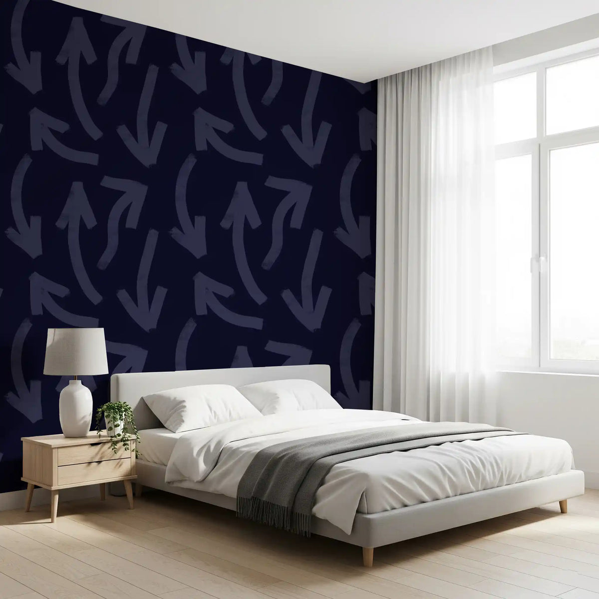 Navy directional stroke wallpaper behind a bed in a bright bedroom GD12469