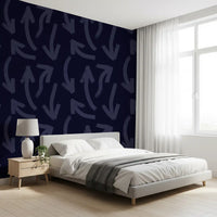 Navy directional stroke wallpaper behind a bed in a bright bedroom GD12469