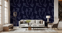 Deep navy brushstroke wallpaper in a living room with grey sofa and plants GD12469