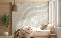 Soft beige flowing-line mural behind a made bed in a warm bedroom GD12473