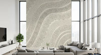 Beige wave-line mural in a living room with a grey sofa and wall TV GD12473