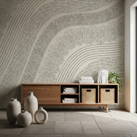 Beige etched mural in a hallway with a wood console and ceramic vases GD12473