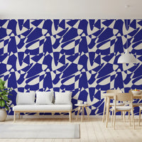 Cobalt shape wallpaper in a dining space with a wood bench and plant GD12480