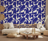 Blue abstract wallpaper in a boho living room with a low cream sofa GD12480