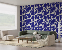 Cobalt abstract wallpaper in a living room with a sage-green sofa GD12480