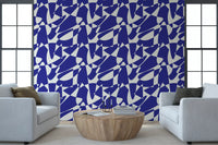 Cobalt shape wallpaper in a living room with pale grey armchairs GD12480