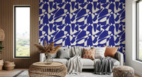 Cobalt cut-out wallpaper in a boho living room with rattan and a cream sofa GD12480